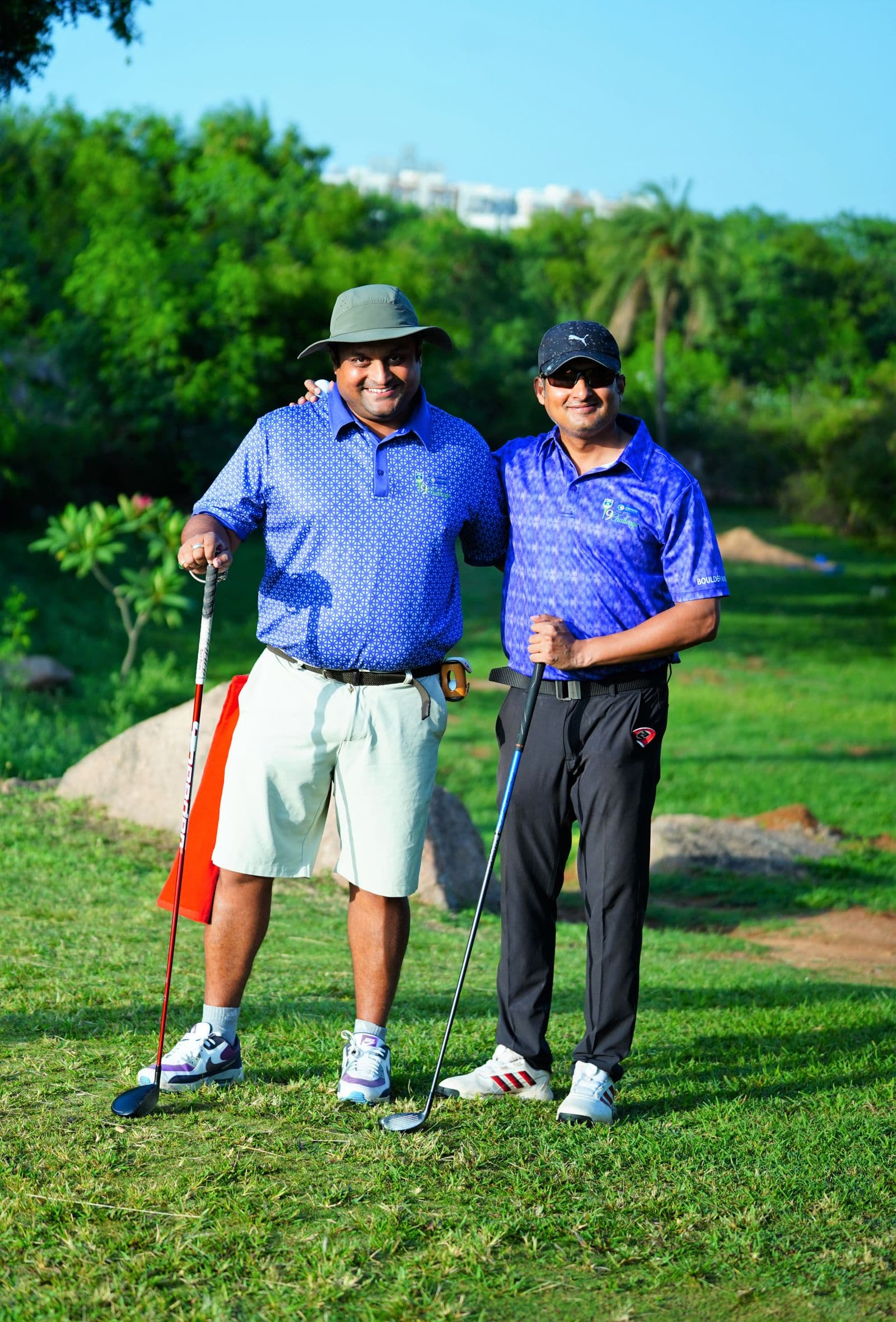 Friends walking together across a golf course