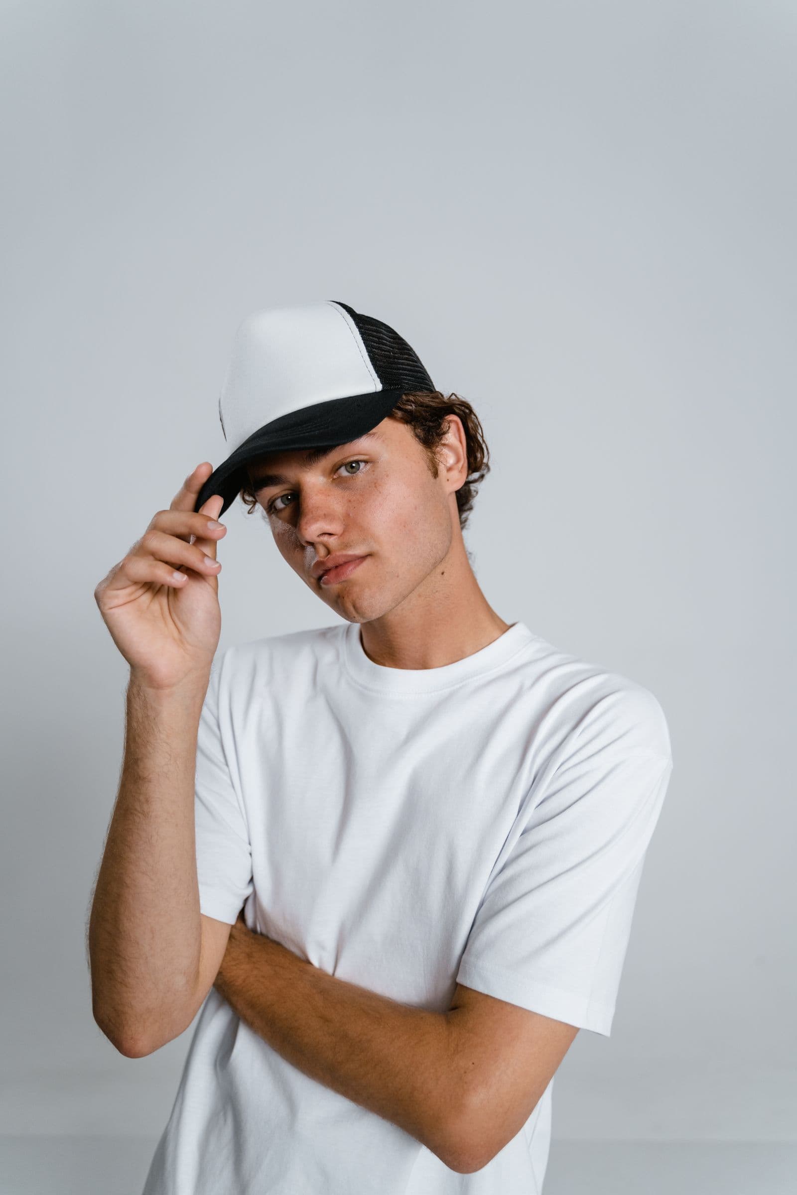 Minimal cap styled with a clean white tee